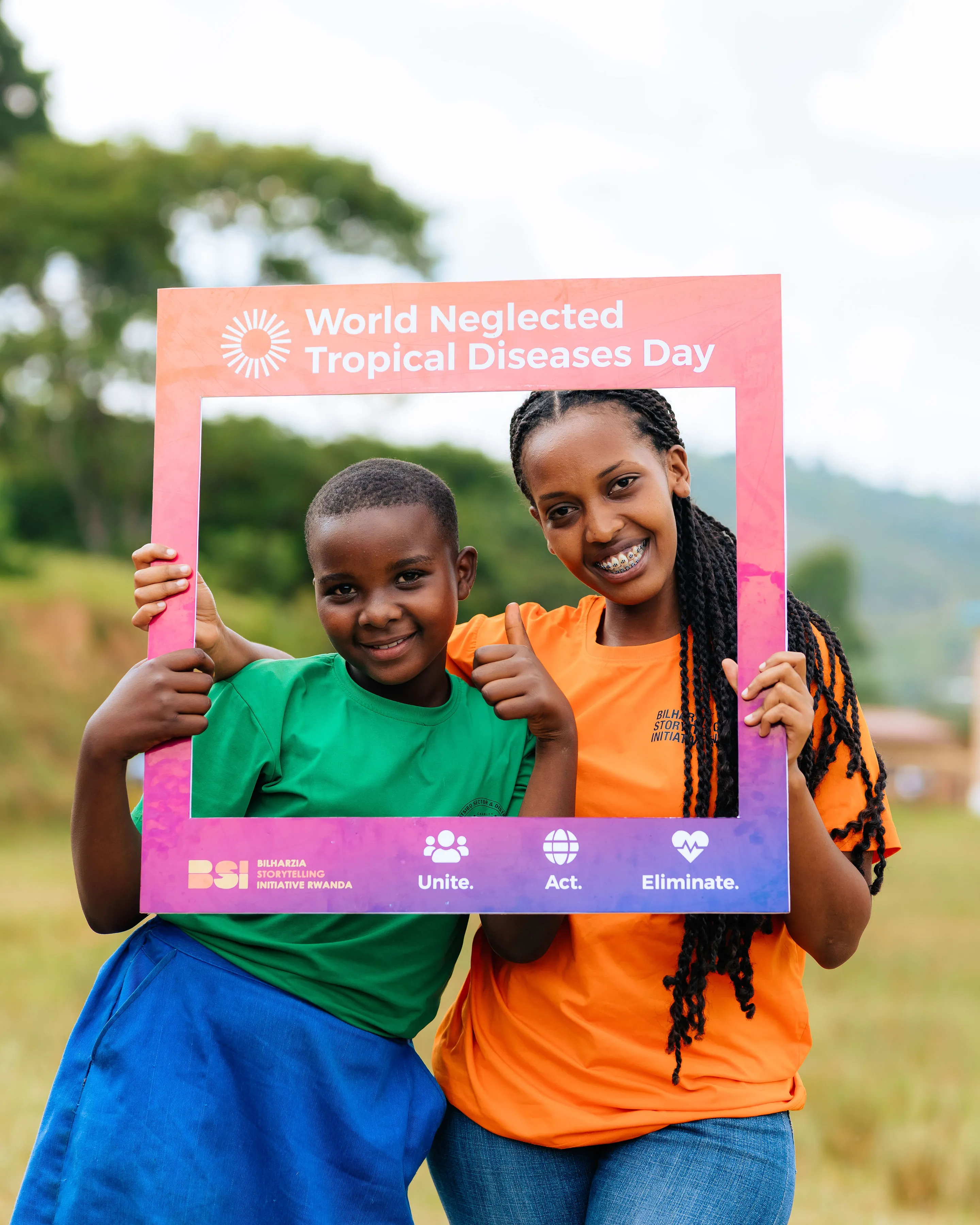 BSI Rwanda staff member with a child during community outreach